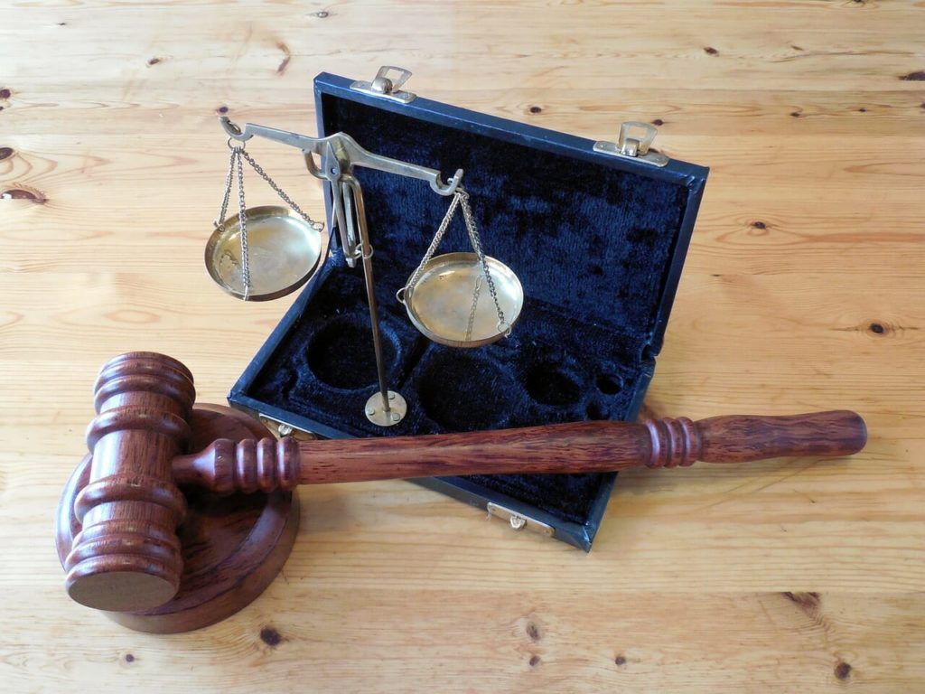 A gavel and a little set of scales 
